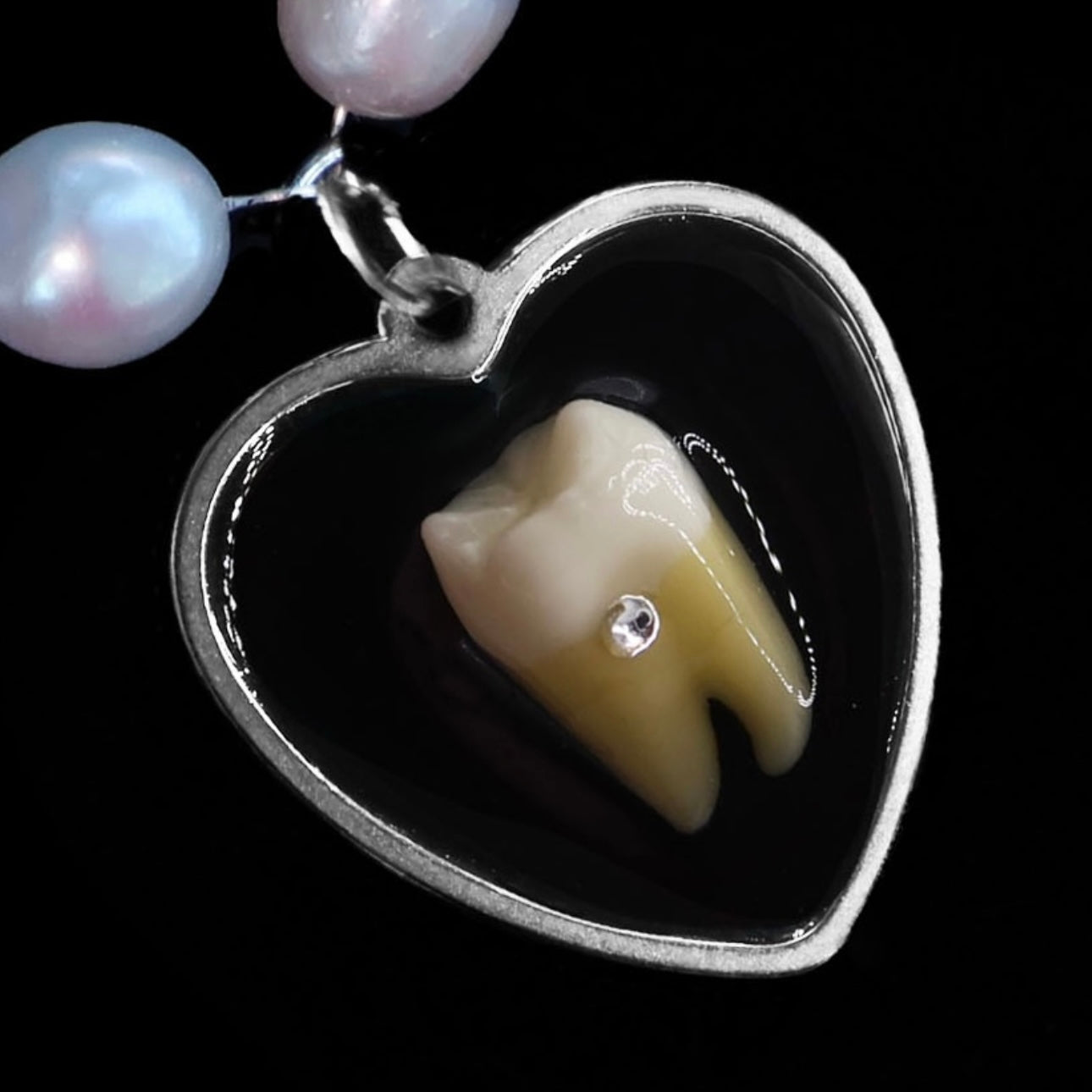 Loose Tooth Uranium Pendant