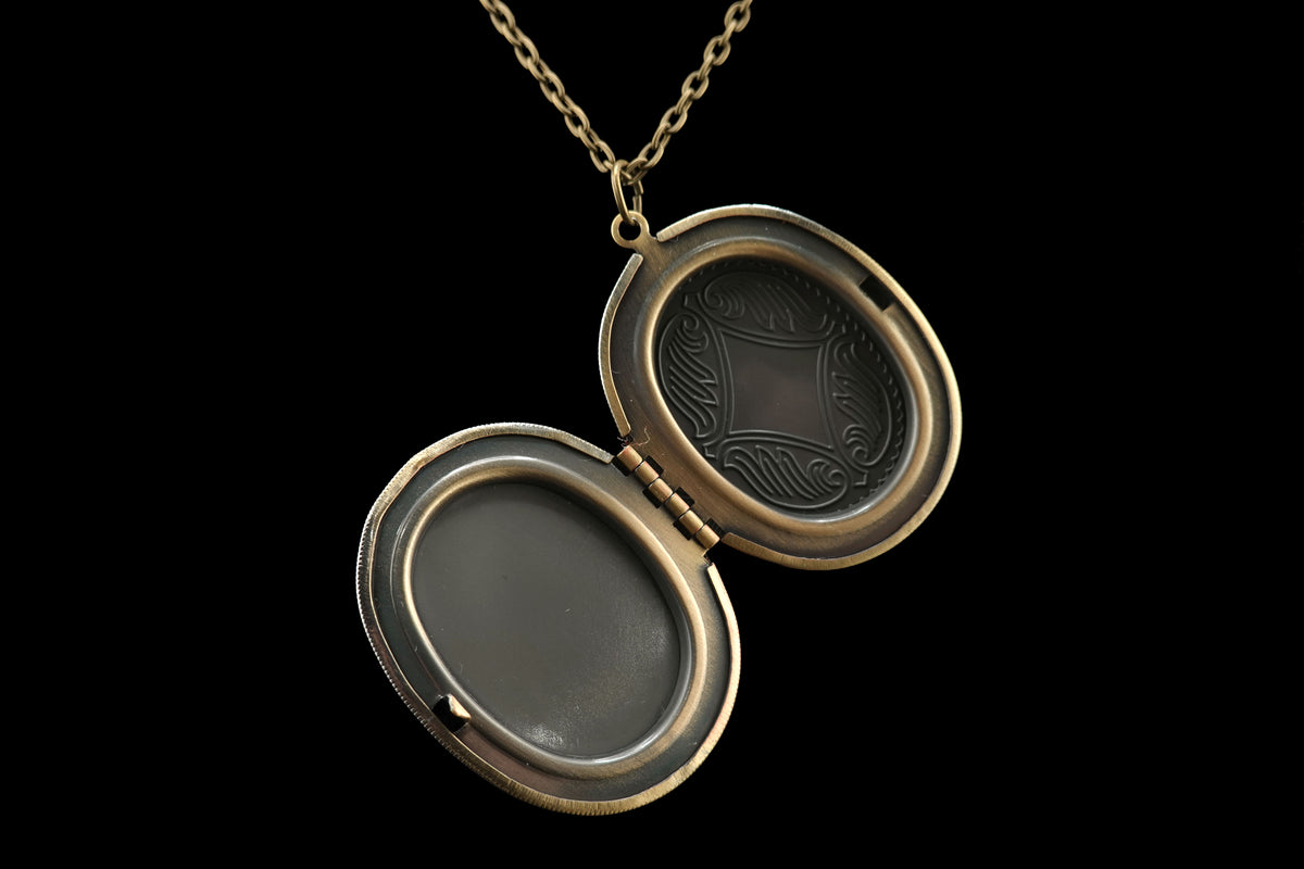 Spinning Webs Locket